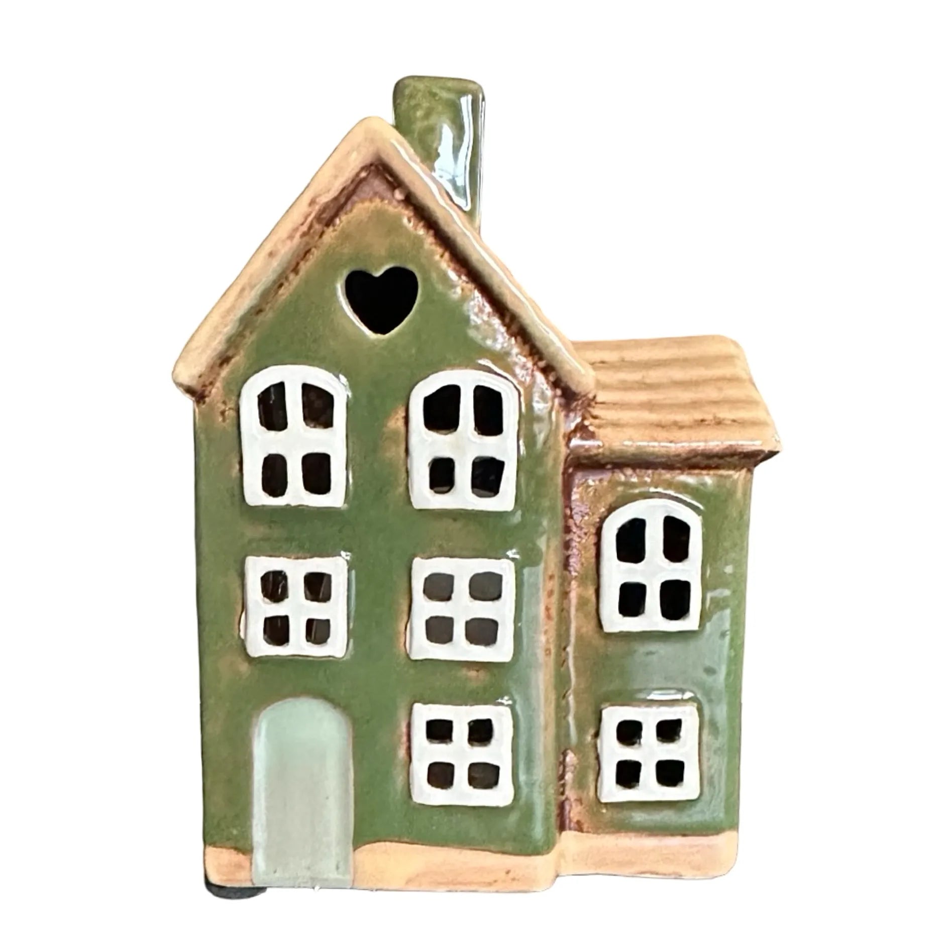 Grönt keramikhus med vita fönster