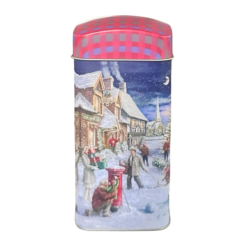 Plåtburk med julmotiv – röd och julig teburk framifrån